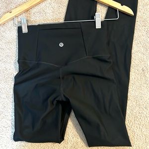 Black Lululemon leggings with back pocket size 4